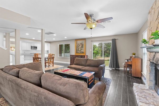 Dining room, Fireplace, Interior, Kitchen, Living room, Recessed Lighting, Wood Texture Flooring