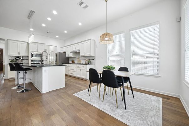 Dining room, Interior, Kitchen, Pendant Lights, Recessed Lighting, Stainless Steel Appliances, Wood Texture Flooring