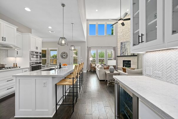 Fireplace, Interior, Kitchen, Living room, Pendant Lights, Recessed Lighting, Stainless Steel Appliances, Wood Texture Flooring