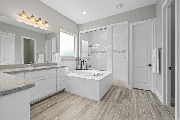 Bathroom, Dual Sink Vanities, Glass Shower, Interior, Marble Walls, Recessed Lighting, Wood Texture Flooring