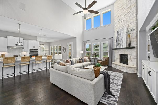 Fireplace, Interior, Kitchen, Living room, Pendant Lights, Recessed Lighting, Stainless Steel Appliances, Stone Walls, Wood Texture Flooring