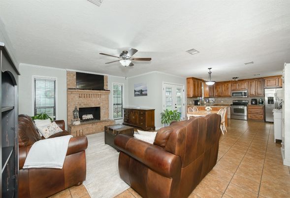 Fireplace, Interior, Kitchen, Living room, Pendant Lights, Stainless Steel Appliances, Stone Walls