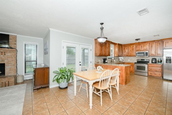Dining room, Fireplace, Interior, Kitchen, Pendant Lights, Stainless Steel Appliances, Stone Walls