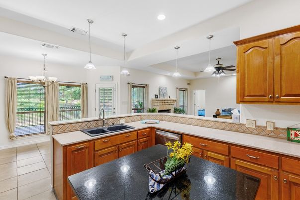 Fireplace, Interior, Kitchen, Pendant Lights, Recessed Lighting, Tile Countertops