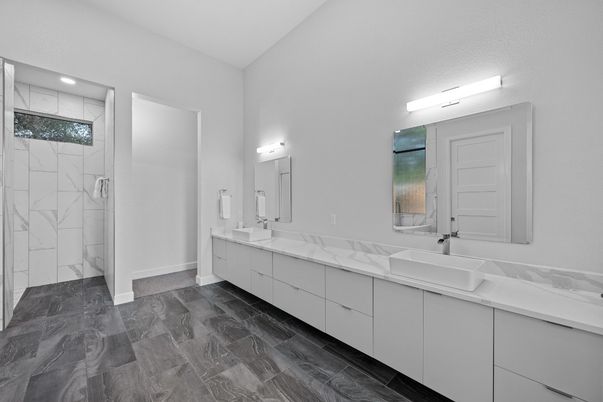 Bathroom, Dual Sink Vanities, Glass Shower, Interior, Marble Walls, Recessed Lighting
