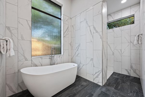 Bathroom, Free Standing Baths, Interior, Marble Walls, Recessed Lighting, Wood Texture Flooring