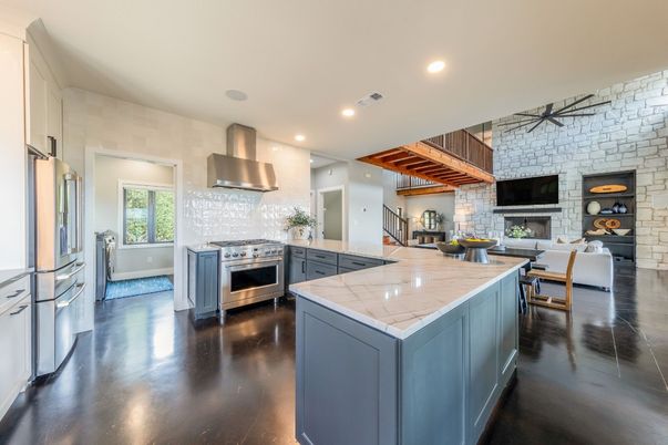 Dining room, Fireplace, Interior, Kitchen, Living room, Pendant Lights, Recessed Lighting, Stainless Steel Appliances, Stone Walls, Wooden Beams, Wood Texture Flooring