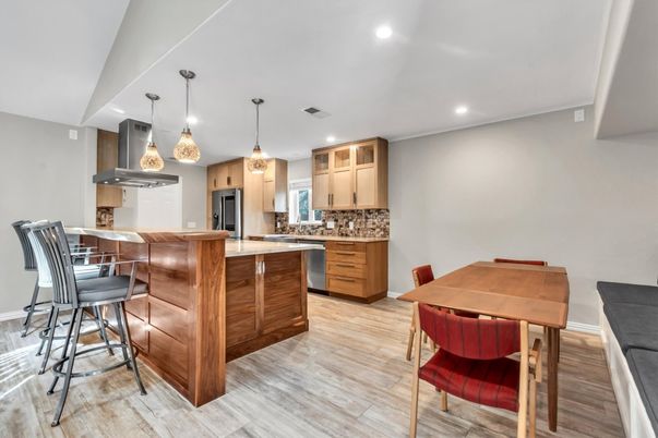 Dining room, Interior, Kitchen, Pendant Lights, Recessed Lighting, Stainless Steel Appliances, Wood Texture Flooring