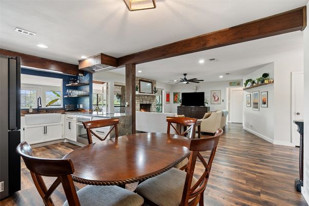 Dining room, Fireplace, Interior, Living room, Recessed Lighting, Wood Texture Flooring