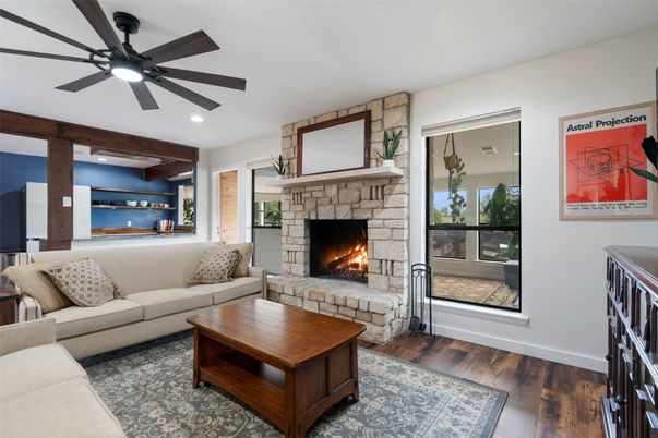 Fireplace, Interior, Living room, Recessed Lighting, Stone Walls, Wood Texture Flooring
