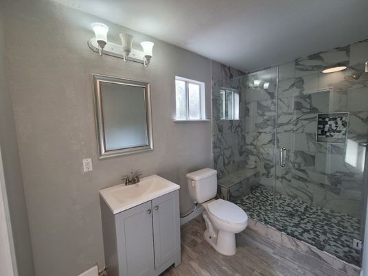 Bathroom, Glass Shower, Interior, Marble Walls, Wood Texture Flooring