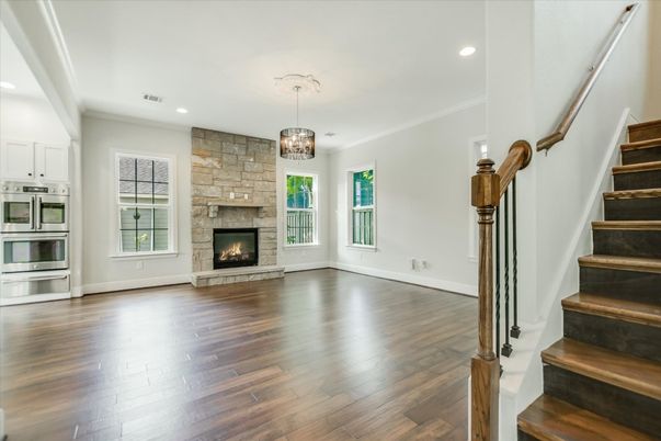 Chandelier, Empty room, Fireplace, Interior, Kitchen, Pendant Lights, Recessed Lighting, Stone Walls, Wood Texture Flooring