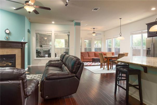 Dining room, Fireplace, Interior, Living room, Pendant Lights, Recessed Lighting, Wood Texture Flooring