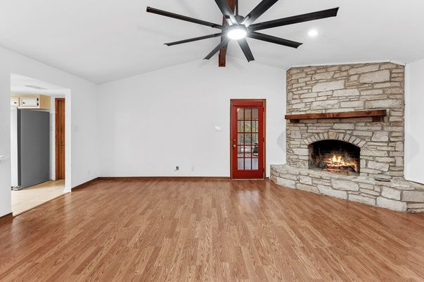 Empty room, Fireplace, Interior, Recessed Lighting, Stone Walls, Wood Texture Flooring