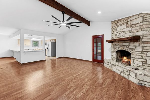 Empty room, Fireplace, Interior, Recessed Lighting, Stone Walls, Wooden Beams, Wood Texture Flooring