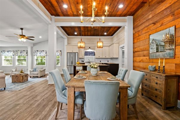 Chandelier, Dining room, Interior, Kitchen, Living room, Pendant Lights, Recessed Lighting, Stainless Steel Appliances, Wooden Ceilings, Wood Texture Flooring