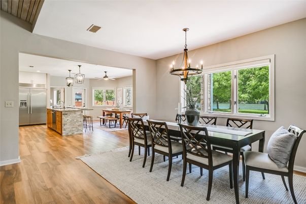 Chandelier, Dining room, Interior, Kitchen, Pendant Lights, Stainless Steel Appliances, Wood Texture Flooring
