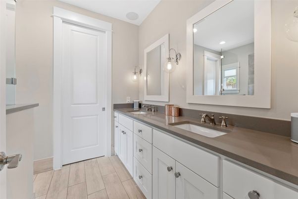 Bathroom, Dual Sink Vanities, Interior, Recessed Lighting, Wood Texture Flooring