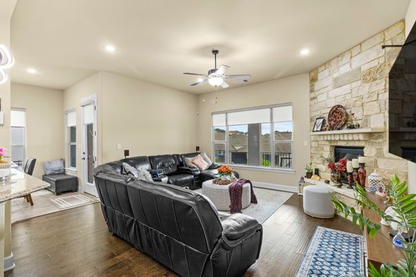 Fireplace, Interior, Living room, Recessed Lighting, Stone Walls, Wood Texture Flooring