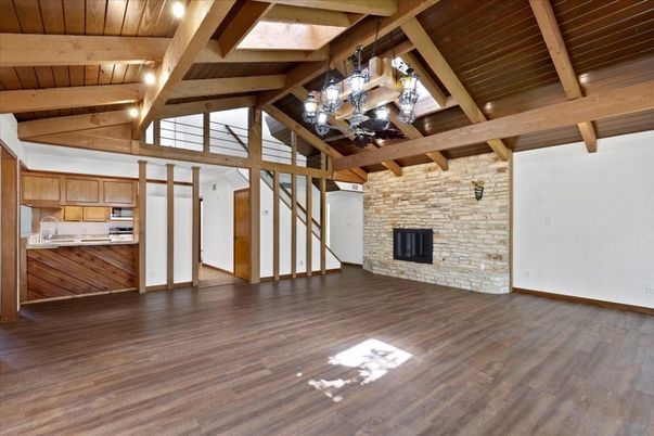 Empty room, Fireplace, Interior, Kitchen, Stone Walls, Wooden Beams, Wooden Ceilings, Wood Texture Flooring