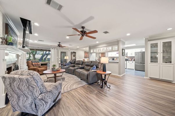 Fireplace, Interior, Kitchen, Living room, Recessed Lighting, Stainless Steel Appliances, Wood Texture Flooring