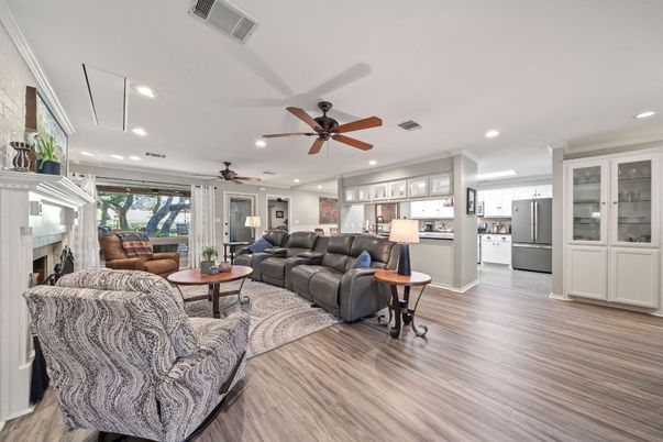 Fireplace, Interior, Kitchen, Living room, Recessed Lighting, Stainless Steel Appliances, Wood Texture Flooring