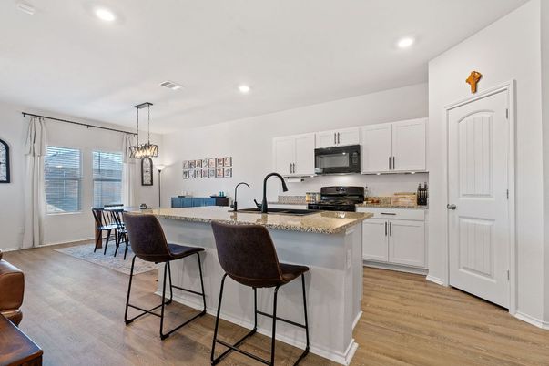 Dining room, Interior, Kitchen, Pendant Lights, Recessed Lighting, Stainless Steel Appliances, Wood Texture Flooring
