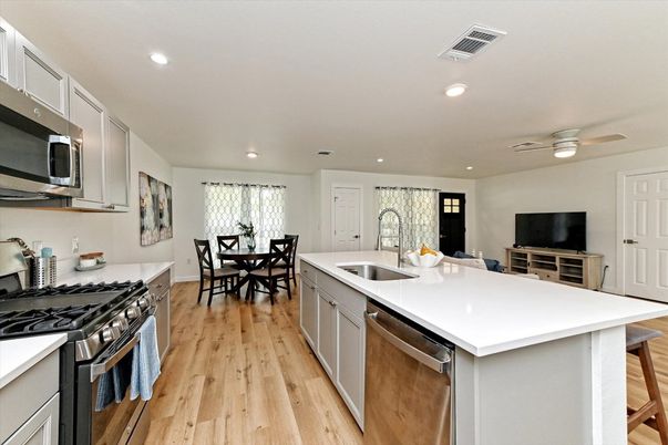 Dining room, Interior, Kitchen, Recessed Lighting, Stainless Steel Appliances, Wood Texture Flooring