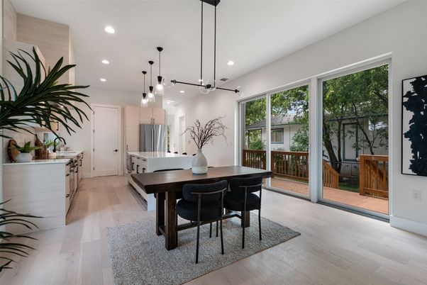 Dining room, Interior, Kitchen, Pendant Lights, Recessed Lighting, Stainless Steel Appliances, Wood Texture Flooring