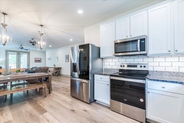 Dining room, Interior, Kitchen, Pendant Lights, Recessed Lighting, Stainless Steel Appliances, Wood Texture Flooring