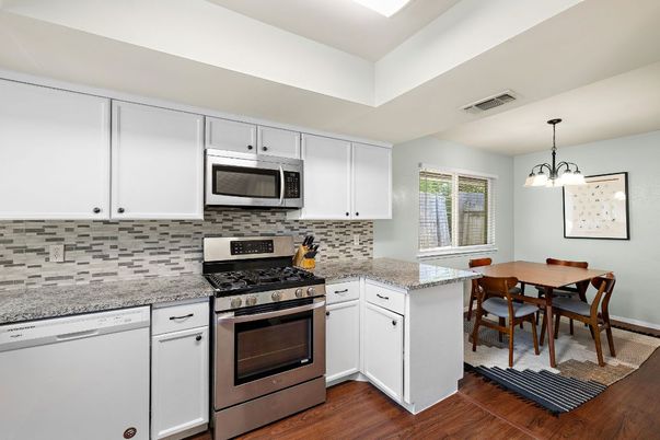 Dining room, Interior, Kitchen, Pendant Lights, Stainless Steel Appliances, Wood Texture Flooring