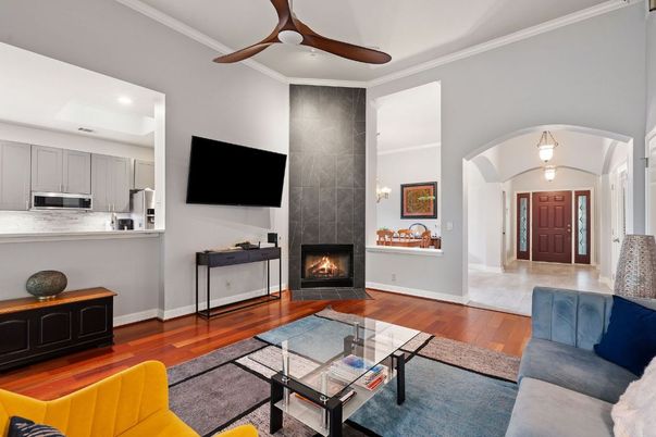 Fireplace, Interior, Kitchen, Living room, Recessed Lighting, Stainless Steel Appliances, Wood Texture Flooring