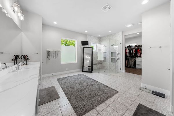 Bathroom, Dual Sink Vanities, Glass Shower, Interior, Marble, Marble Walls, Recessed Lighting, Wood Texture Flooring