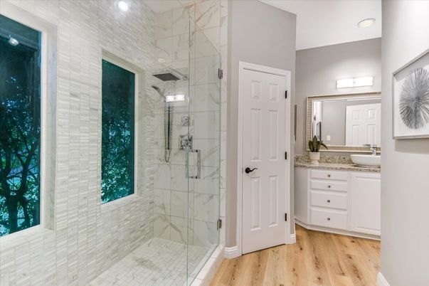 Bathroom, Glass Shower, Interior, Marble Walls, Recessed Lighting, Wood Texture Flooring