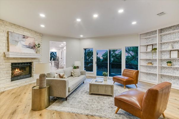 Fireplace, Interior, Living room, Recessed Lighting, Stone Walls, Wood Texture Flooring