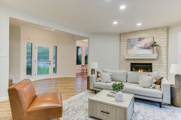 Fireplace, Interior, Living room, Recessed Lighting, Stone Walls, Wood Texture Flooring