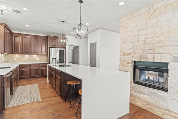 Fireplace, Interior, Kitchen, Pendant Lights, Recessed Lighting, Stone Walls, Wood Texture Flooring