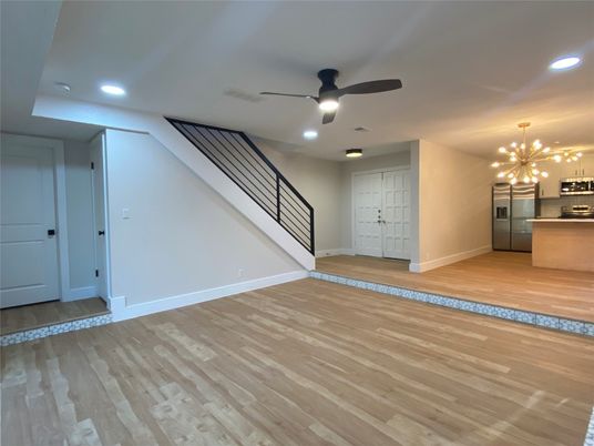 Empty room, Interior, Kitchen, Recessed Lighting, Stainless Steel Appliances, Wood Texture Flooring