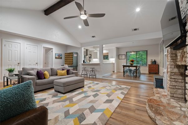 Dining room, Fireplace, Interior, Living room, Pendant Lights, Recessed Lighting, Stone Walls, Wooden Beams, Wood Texture Flooring