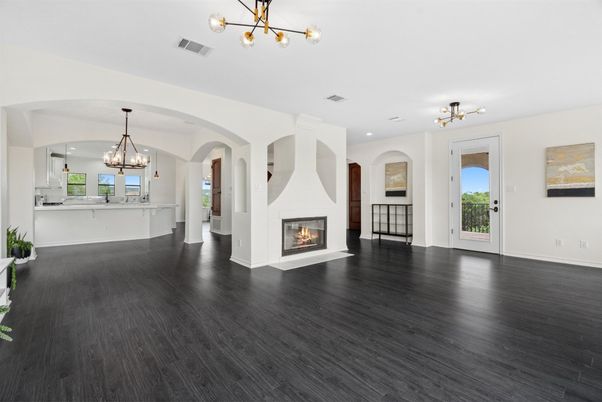 Chandelier, Empty room, Fireplace, Interior, Pendant Lights, Recessed Lighting, Wood Texture Flooring