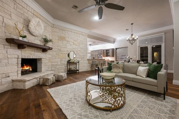 Chandelier, Dining room, Fireplace, Interior, Living room, Recessed Lighting, Stone Walls, Wood Texture Flooring