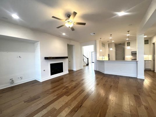 Empty room, Fireplace, Interior, Kitchen, Pendant Lights, Recessed Lighting, Wood Texture Flooring
