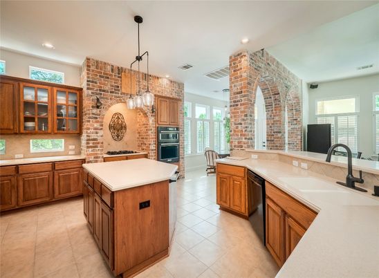 Fireplace, Interior, Kitchen, Pendant Lights, Recessed Lighting, Stainless Steel Appliances, Stone Walls