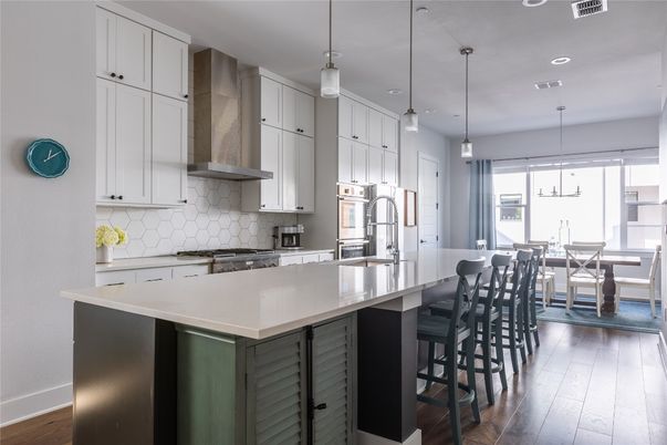 Dining room, Interior, Kitchen, Pendant Lights, Recessed Lighting, Stainless Steel Appliances, Wood Texture Flooring