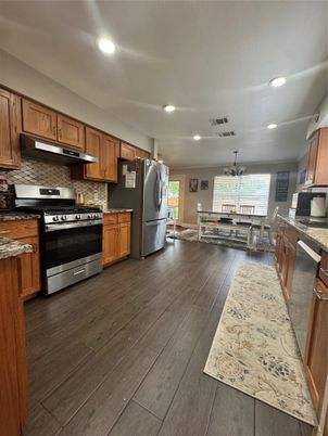 Dining room, Interior, Kitchen, Recessed Lighting, Stainless Steel Appliances, Wood Texture Flooring