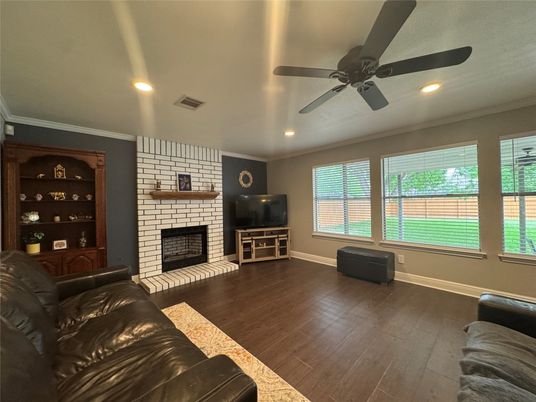 Fireplace, Interior, Living room, Recessed Lighting, Stone Walls, Wood Texture Flooring
