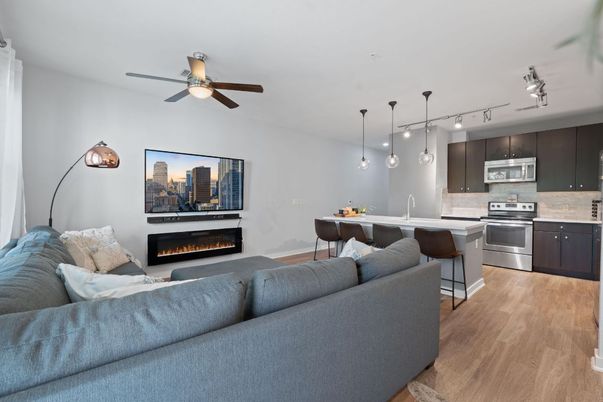 Dining room, Fireplace, Interior, Kitchen, Living room, Pendant Lights, Stainless Steel Appliances, Wood Texture Flooring