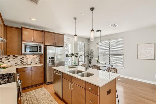 Dining room, Interior, Kitchen, Pendant Lights, Recessed Lighting, Stainless Steel Appliances, Wood Texture Flooring