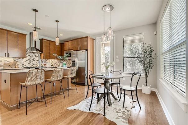 Dining room, Interior, Kitchen, Pendant Lights, Recessed Lighting, Stainless Steel Appliances, Wood Texture Flooring
