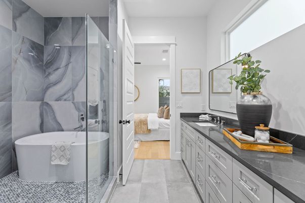 Bathroom, Bedroom, Dual Sink Vanities, Free Standing Baths, Glass Shower, Interior, Marble Walls, Recessed Lighting, Wood Texture Flooring